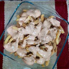 A picture of Chicken and Chips with Mayo Sauce.