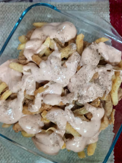 A picture of Chicken and Chips with Mayo Sauce.