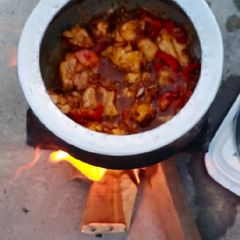 A picture of Orignal chicken salan on wood fire.