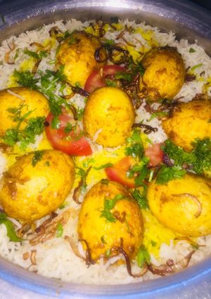 A picture of Mix egg and mutton biryani with smokey flavour.