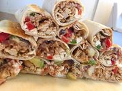 A picture of shredded chicken burritos