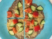 A picture of hummus and pita bread