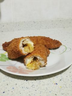 Una foto de Rollito de lomo con queso y cebolla caramelizada