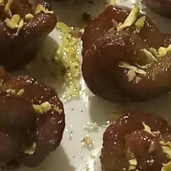 A picture of Gulab jamun (rose shape).