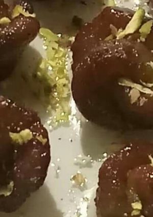 A picture of Gulab jamun (rose shape).