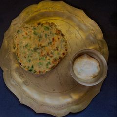 Methi Aloo Paratha & Spring Onion Raita A picture of Methi Aloo Paratha & Spring Onion Raita.