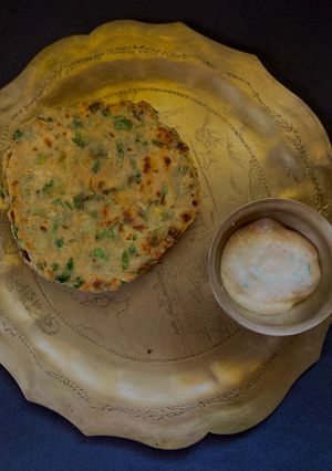 A picture of Methi Aloo Paratha & Spring Onion Raita.