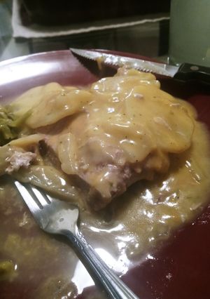 A picture of Smothered and Covered Pork Chops.