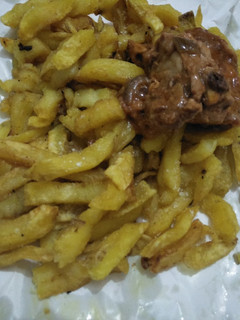A picture of Fries with chicken.