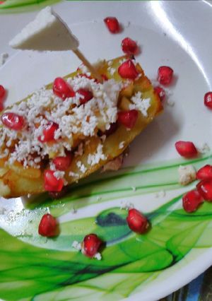 A picture of Sweet potato boat with fruits.