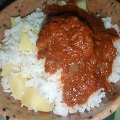A picture of White Rice with Potatoes and Stew.