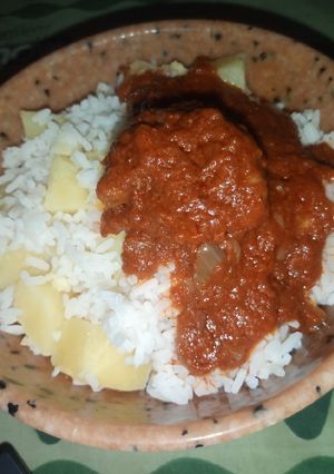A picture of White Rice with Potatoes and Stew.