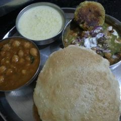 A picture of Chole bhature, ALOO Tikki, kheer.