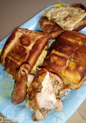 A picture of Toasted Bread With Eggs and grilled Chicken.