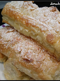 Una foto de Cañas de hojaldre rellenas de crema pastelera