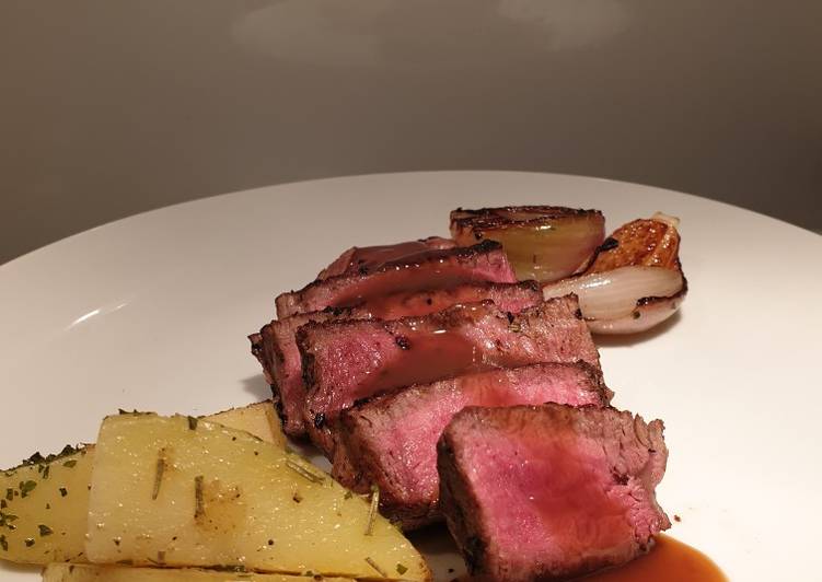 Eye fillet steak with herb butter potatoes and veggies