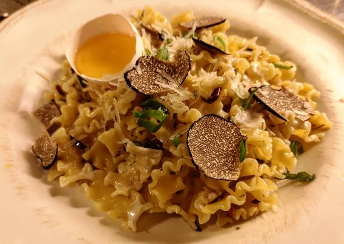 Truffle pasta served with raw egg yolk