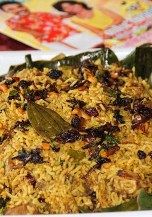 A picture of Vazhayilayil Oru Suriyani Biriyani / Kerala Suriyanese Style Biryani Wrapped in Banana Leaf.