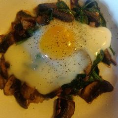 A picture of Baked Egg on Spinach and Shrooms.