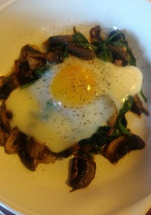 A picture of Baked Egg on Spinach and Shrooms.