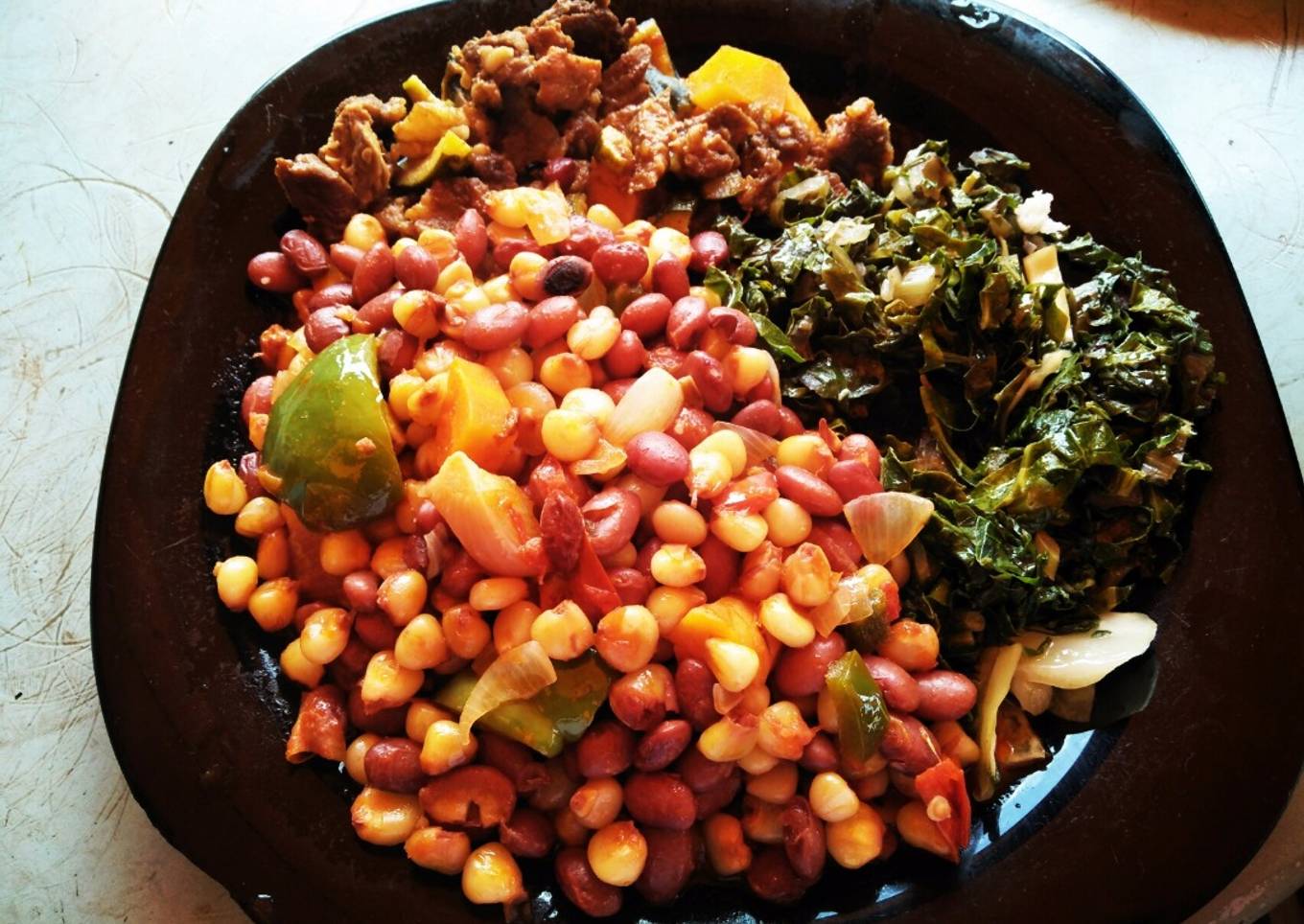 Stewed githeri with beef And greens