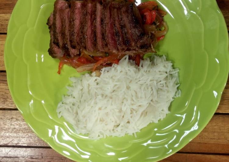 Sweet and sour peppers, medium rare rib eye and coconut rice