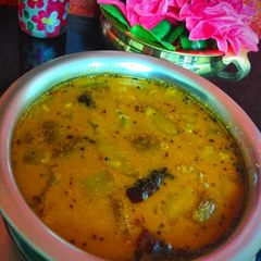 A picture of Mangalore cucumber huli(sambhar).