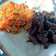 A picture of Sauteed liver with tomato stew.
