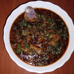 A picture of Methi chicken (fenugreek leaves chicken) 🌱🐔🍅🧅.