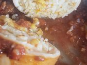 Una foto de calamares en salsa con comino