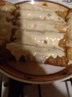 Una foto de Canelones, espinaca pollo y panceta masa de harina de garbanzo