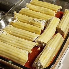 A picture of Cheese and beef manicotti.
