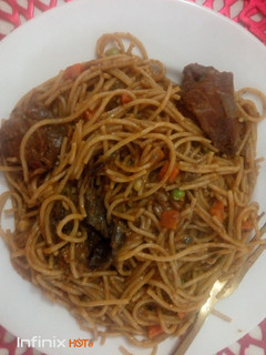 A picture of Zee's Spaghetti with Chicken and dry fish.