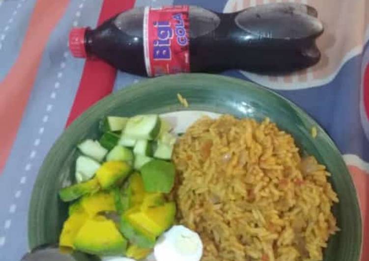Jollof rice,boiled egg avacado and cucumber