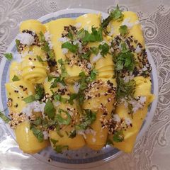 A picture of Tadka sesame khandvi.