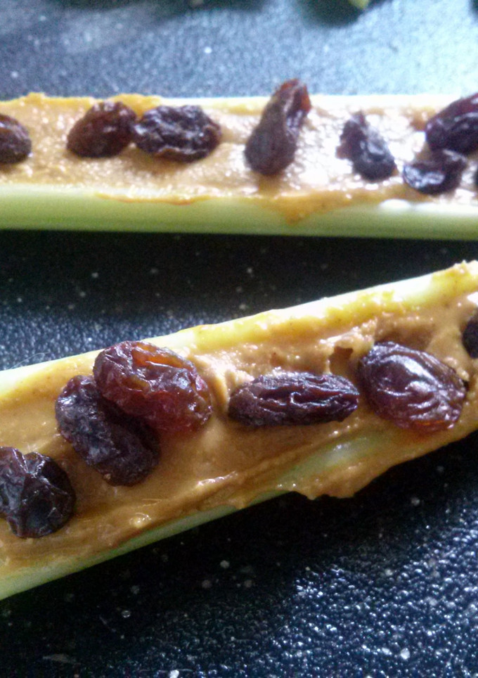 A picture of Ants on a log.
