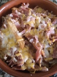 Una foto de Patatas con bacon y queso