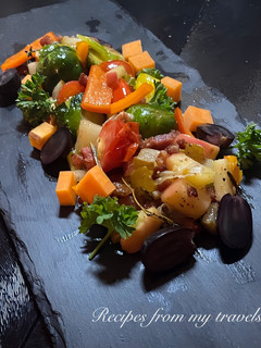 A picture of WARM SALAD OF PANCETTA, SWEET POTATOES AND SPROUTS.