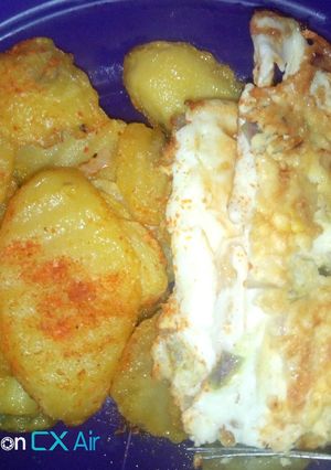 A picture of Fried potatoes and omellete.