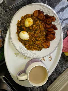 A picture of Beans porridge paired with plantain and boiled eggs.