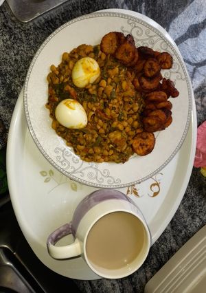 A picture of Beans porridge paired with plantain and boiled eggs.
