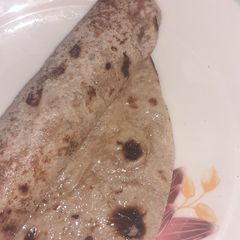 A picture of Ghee cheeni roti roll.