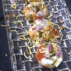 A picture of Aloo pakora chat.