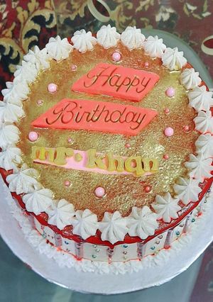 A picture of Red velvet cake with white chocolate cream cheese frosting.