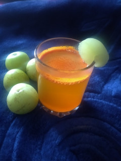 A picture of Amla& turmeric golden morning detox drink.