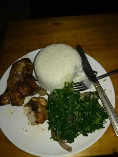 A picture of Rice and kale with chicken.