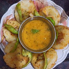 A picture of Roasted sandwich idli with salad.