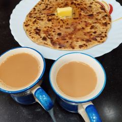 A picture of Sattu Paratha with onion.