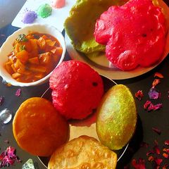 A picture of Colourful pooris.