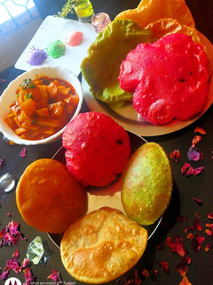 A picture of Colourful pooris.